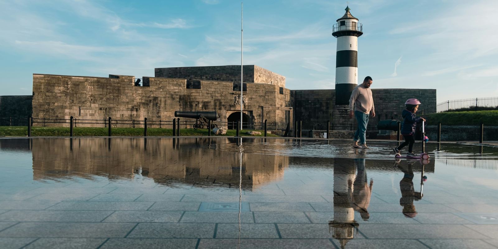 Child on a scooter outside Southsea Castle